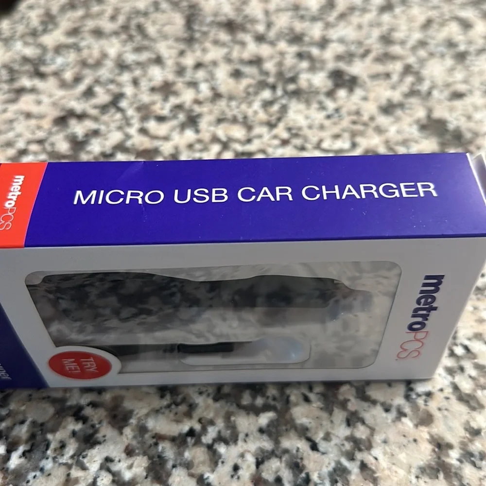 New METRO PCS Micro USB Car Charger. Compatible with USB Handsets.